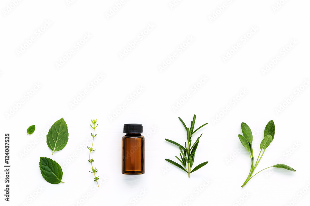 Bottle of essential oil with  fresh herbal sage, rosemary, thyme - obrazy, fototapety, plakaty 