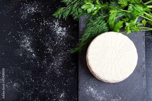 cheese on a dark wooden surface