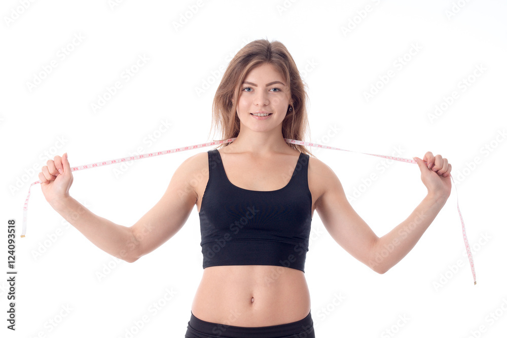 close-up of young slender athletic girl who is smiling and holdi close-up of young slender athletic girl who is smiling and holdi