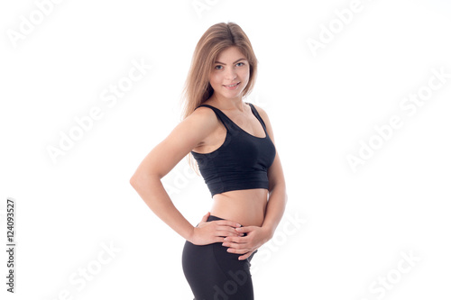 Athletic beautiful body of a young girl who is smiling © ponomarencko