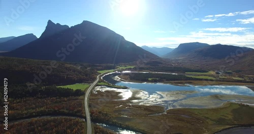 Cinema 4k 180 degree aerial of the autumn colored mountains and water between elsnes, hatteng and oteren, in North Norway photo