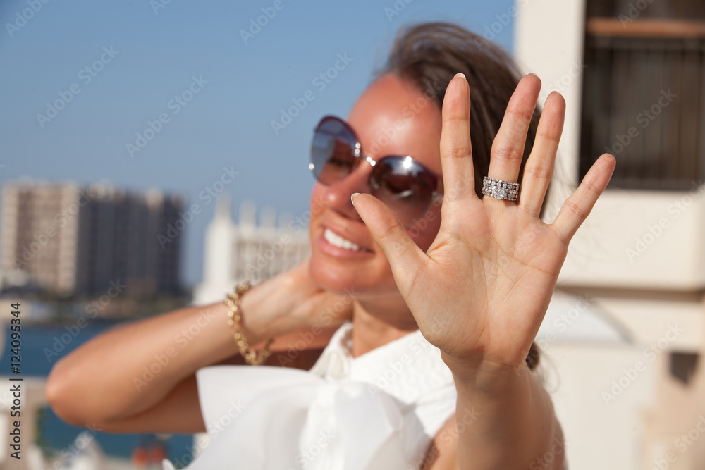 Fototapeta premium Close up of woman hand showing beautiful ring with diamond.