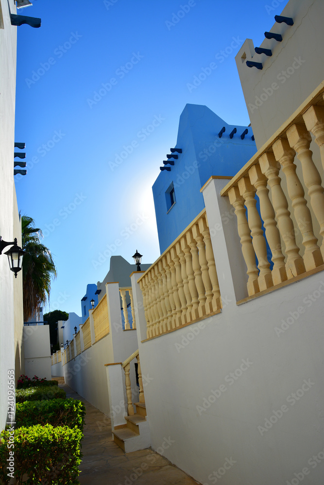 Classical Greek architecture at dawn: staircase, white and blue building