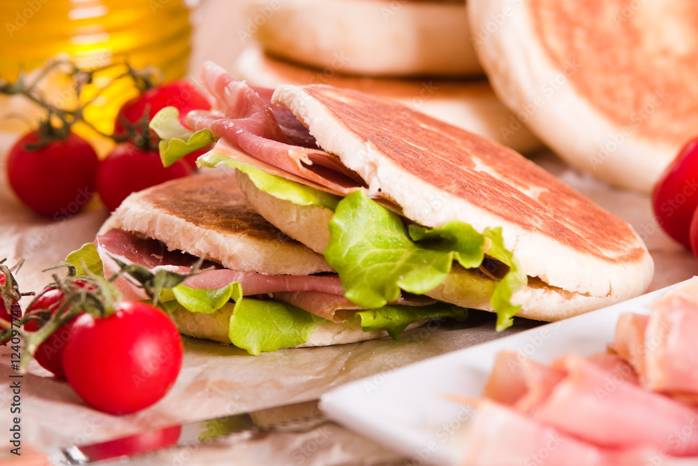 Tigella bread stuffed with ham and lettuce. Tigella bread stuffed with ham and lettuce.