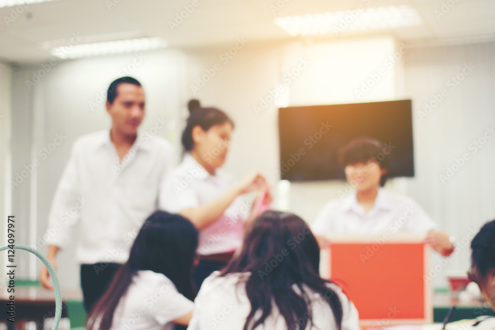 Education concept on blurred students in classroom. Classroom students in university. Free education. Team teaching. Education concept on blurred students in classroom. Classroom students in university. Free education. Team teaching.