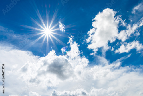 Blue sky with clouds and sun