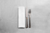 Blank white restaurant napkin mock up with fork and knife, isolated. Cutlery near clear textile towel mock up template. Cafe branding identity clean napkin surface for restaurant logo design branding.