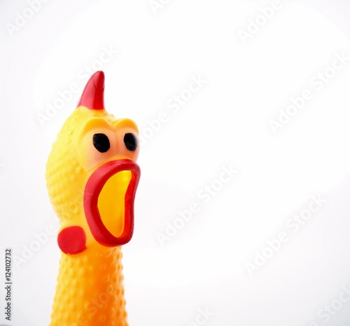 Yellow shrilling chicken with red lips on white background