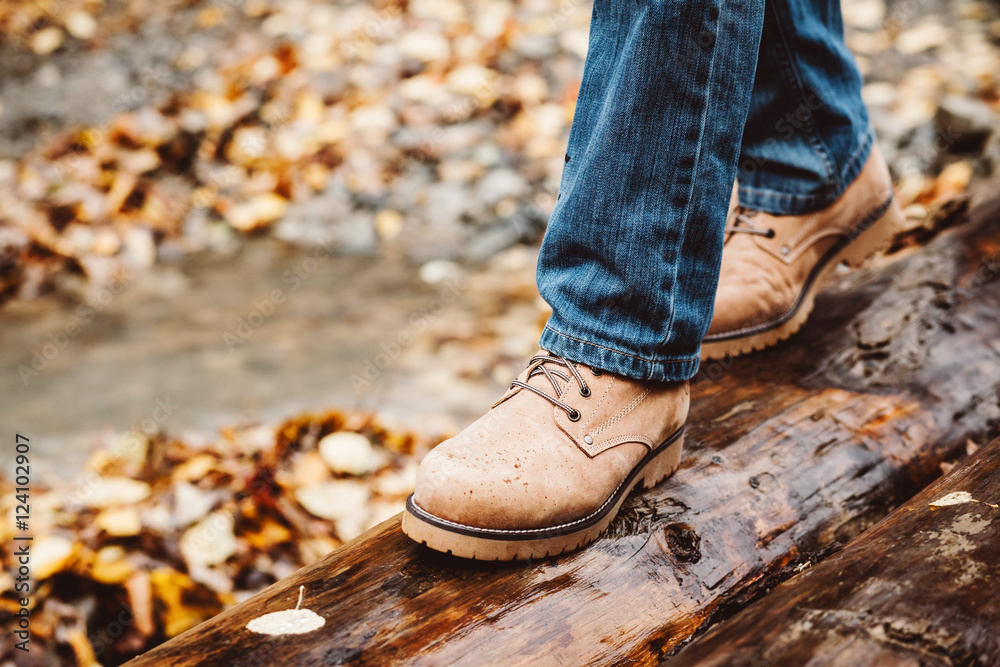 Hiker walking in boots closeup Hiker walking in boots closeup