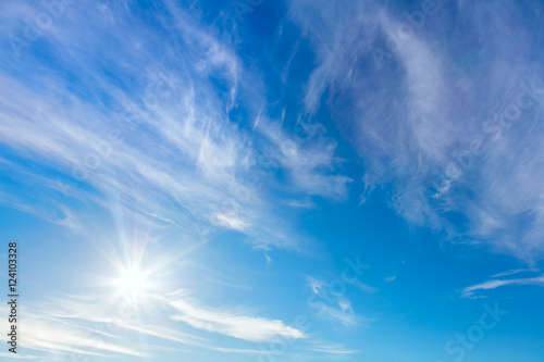 Happy Sunny background of blue sky with real sun