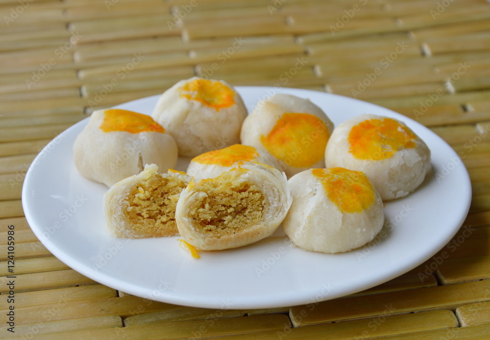 Chinese pastry filling sweet bean and salty egg yolk on dish Chinese pastry filling sweet bean and salty egg yolk on dish