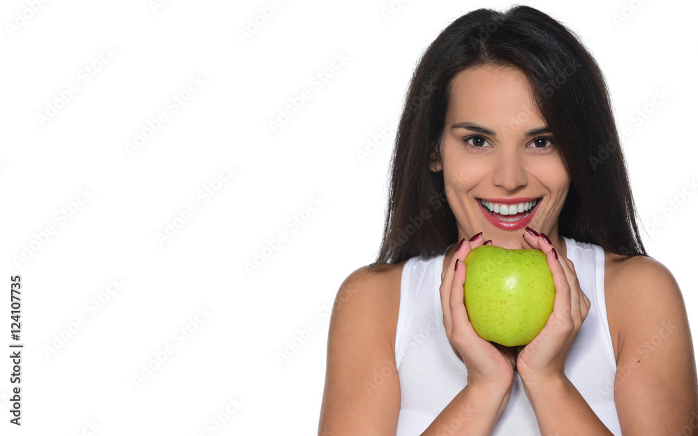 smiling woman with healthy teeth holding/eating apple. studio isolated portrait. smiling woman with healthy teeth holding/eating apple. studio isolated portrait.