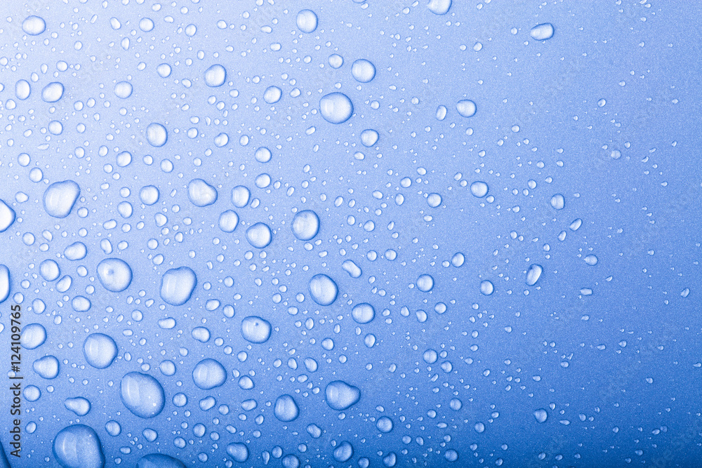 Drops of water on a color background. Blue. Toned