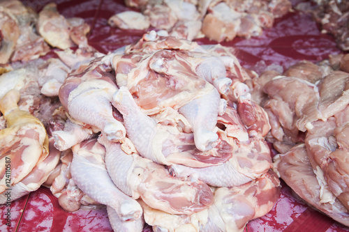 Raw chicken drumstsicks in the market Thailand photo