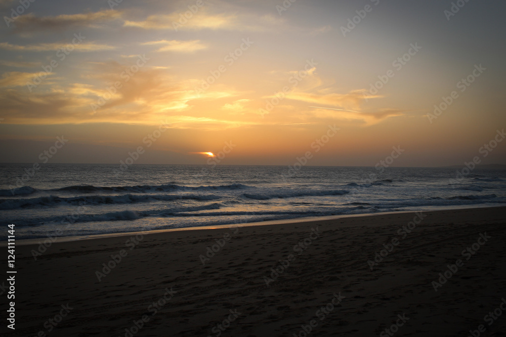 Sunset time at Atlantic Ocean coast near Albufeira, Portugal