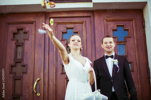 young people throw candy to guests