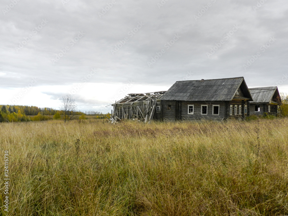 Old houses in the abandoned village in Kostroma Oblast