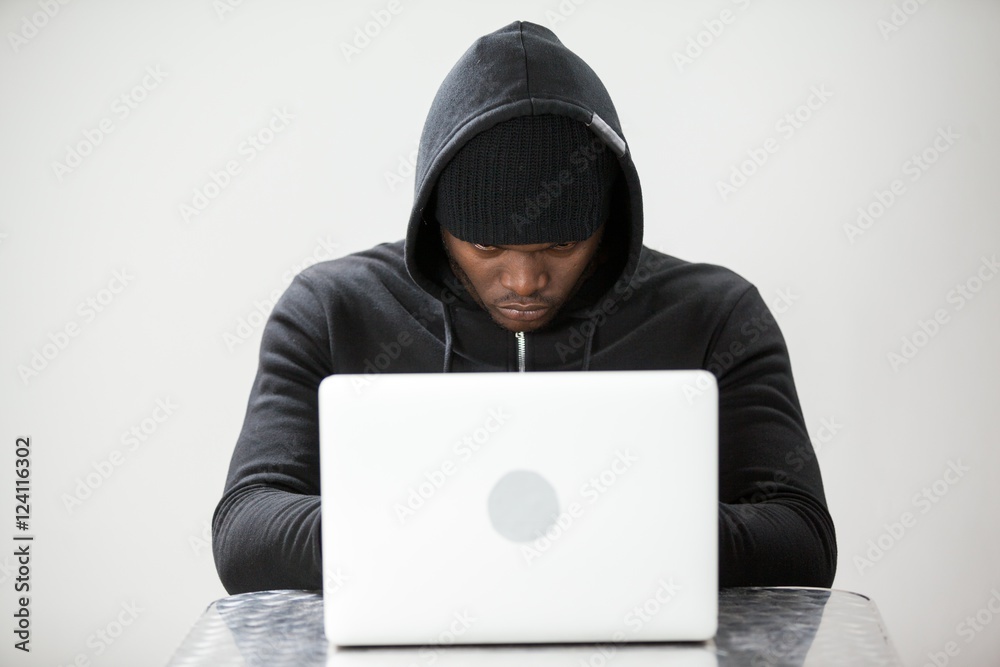 Hacker using a laptop Hacker using a laptop