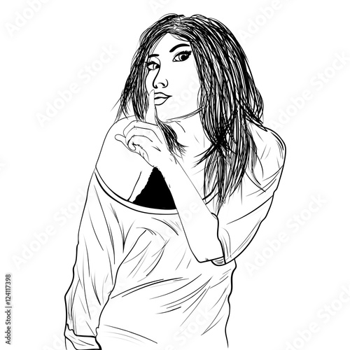 girl making a hush sign with her finger.