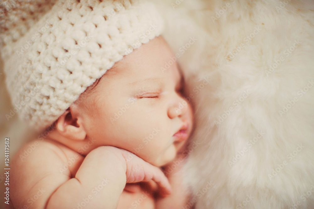 Incredible and sweet newborn baby sleeps on the bed Incredible and sweet newborn baby sleeps on the bed