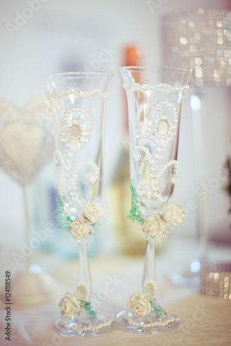 Wedding champagne flutes decorated with pearls and crystals