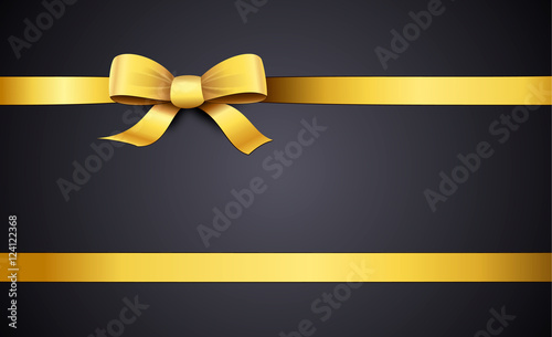 Gold ribbon on black background with copy space