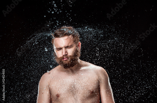 The water splash on male face