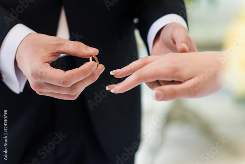 wedding rings and groom bride