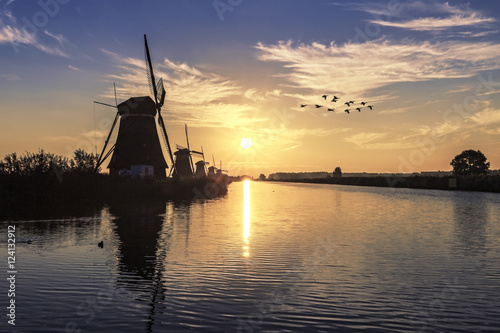Beautiful sunrise on the Kinderdjik windmills alignment nearby A photo