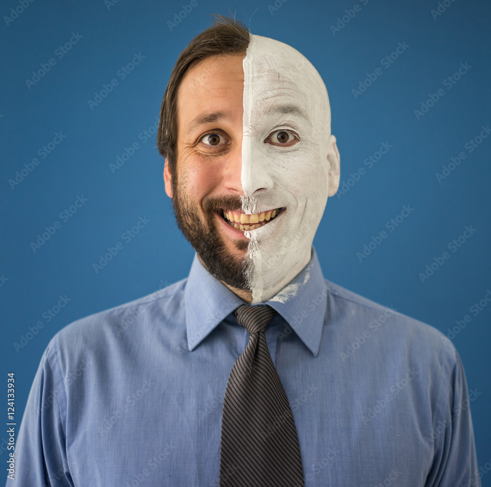 Conceptual two sides face portait photo of a businessman