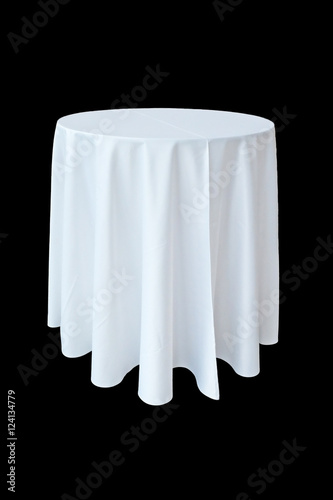 Banquet table with white tablecloth isolated on black