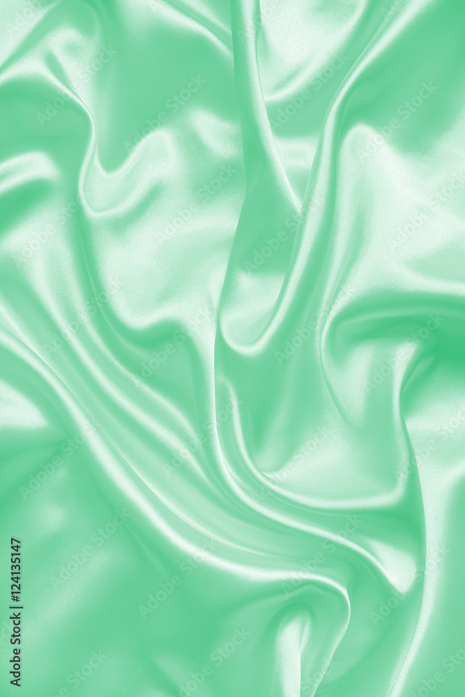 Obraz premium Smooth elegant green silk or satin texture as background