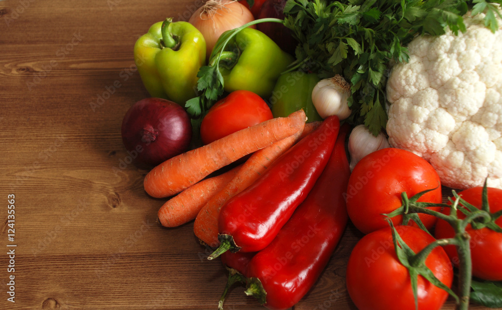 Healthy organic vegetables on brown wooden table Healthy organic vegetables on brown wooden table