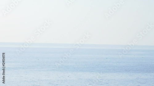 Following the sea and a lighthouse near the sea, blue calm sea photo