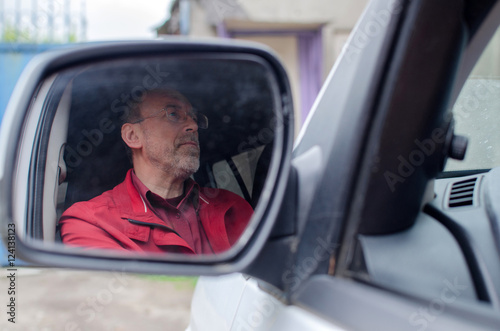 Aged man in the car © retoncy