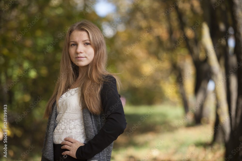 Girl with a cute smile on sunny autumn day Girl with a cute smile on sunny autumn day