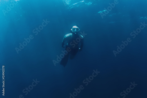 Freediver man swimming in sea