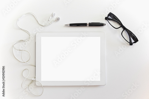 Smart tablet with pen and glasses on white office desk