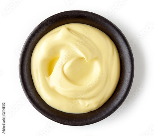 Mayonnaise in round dish on white background photo