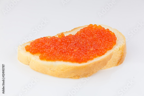 delicious appetizing sandwich with red caviar on  white