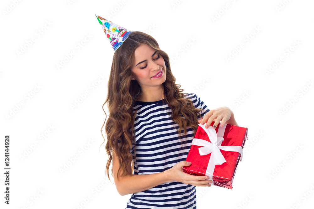 Woman in celebration cap holding a present Woman in celebration cap holding a present