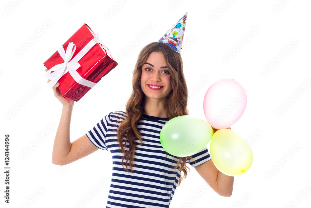 Woman holding present and balloons Woman holding present and balloons
