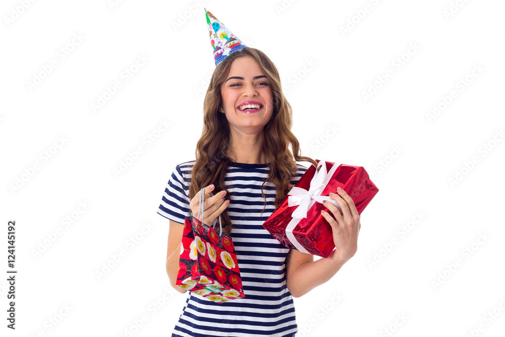 Woman in celebration cap holding presents 