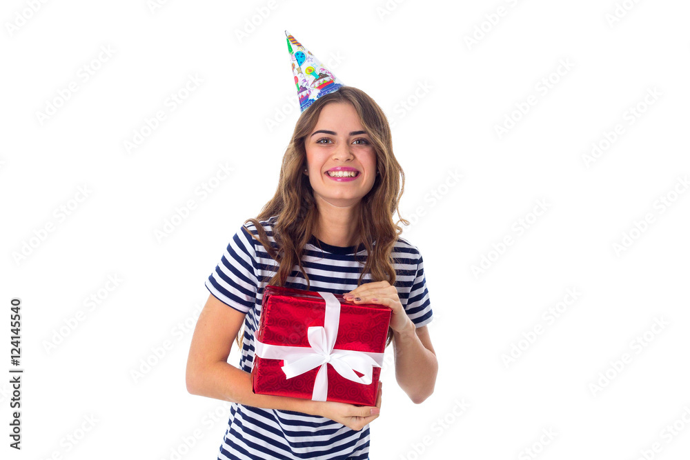 Woman in celebration cap holding a present Woman in celebration cap holding a present
