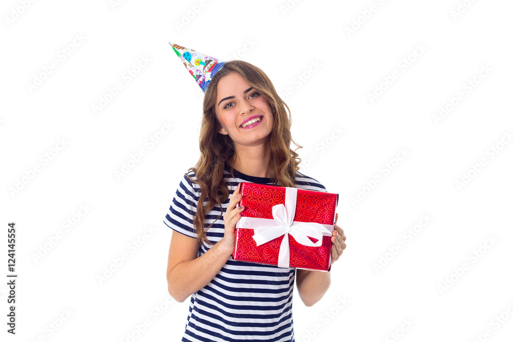 Woman in celebration cap holding a present Woman in celebration cap holding a present