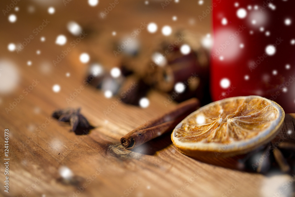 cinnamon, anise and dried orange on wooden board cinnamon, anise and dried orange on wooden board