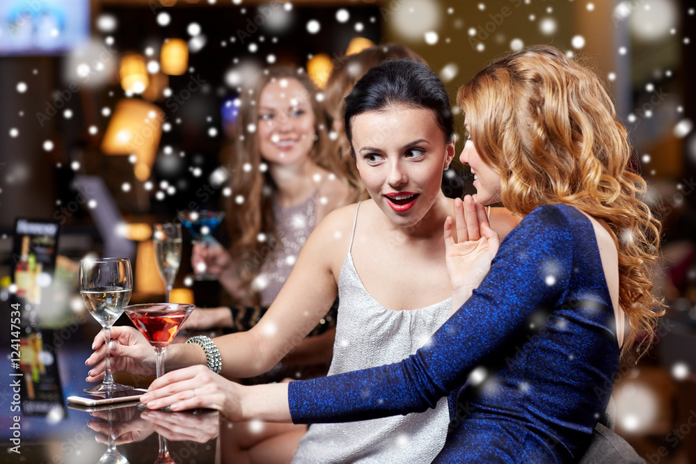 happy women with drinks at night club happy women with drinks at night club