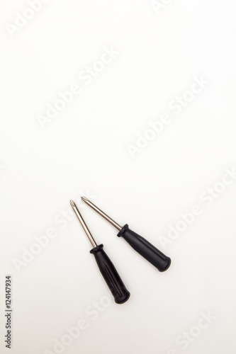 colorful screwdrivers on white backgrounds