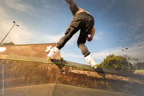 Very Aggressive rollerblading at skatepark photo