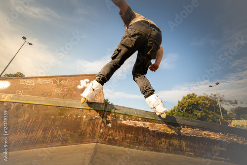 Very Aggressive rollerblading at skatepark